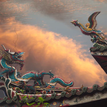 500px Photo ID: 132008549 - A Dragon and a Phoenix (Fenghuang fènghuáng / 凤凰 / 鳳凰 or August Rooster kūnjī / 鹍鸡 / 鶤雞) on the roof of Mengjia Longshan Temple (艋舺龍山寺 nee Lungshan Temple) in Wanhua District, Taipei, Taiwan. Golden Hour, dramatic clouds in background. Temple is of Chinese folk religion.