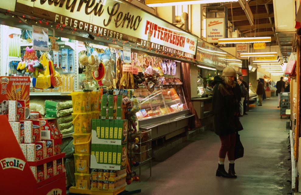 Shoppers and stalls inside Marheineke Markthalle, Marheinekeplatz.