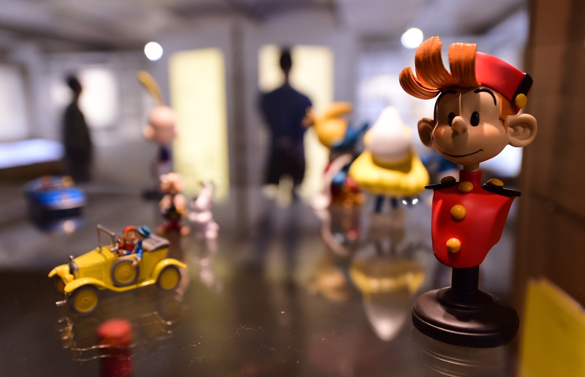TO GO WITH AFP STORY BY PHILIPPE SIUBERSKI .A figurine of cartoon character "Spirou" is seen in the "Centre Belge de la Bande Dessinee" (Belgian Comic Strip Center) on October 3, 2014 in Brussels, as it marks its 25th anniversary. The museum, one of the largest worldwide dedicated to comic strip art, marks its 25th anniversary with a series of special exhibitions and happenings. Spirou has been written and drawn since 1938 by a succession of artists, as Rob-Vel, Jije, Franquin, Yoann, Vehlmann, Schwartz and Bravo for comics publisher Dupuis. AFP PHOTO/ EMMANUEL DUNAND == RESTRICTED TO EDITORIAL USE, MANDATORY CREDIT OF THE ARTIST, TO ILLUSTRATE THE EVENT AS SPECIFIED IN THE CAPTION ==        (Photo credit should read EMMANUEL DUNAND/AFP/Getty Images)