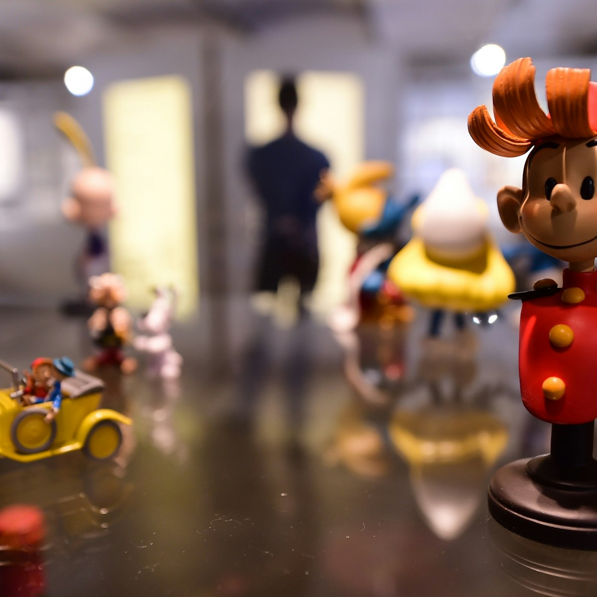 TO GO WITH AFP STORY BY PHILIPPE SIUBERSKI .A figurine of cartoon character "Spirou" is seen in the "Centre Belge de la Bande Dessinee" (Belgian Comic Strip Center) on October 3, 2014 in Brussels, as it marks its 25th anniversary. The museum, one of the largest worldwide dedicated to comic strip art, marks its 25th anniversary with a series of special exhibitions and happenings. Spirou has been written and drawn since 1938 by a succession of artists, as Rob-Vel, Jije, Franquin, Yoann, Vehlmann, Schwartz and Bravo for comics publisher Dupuis. AFP PHOTO/ EMMANUEL DUNAND == RESTRICTED TO EDITORIAL USE, MANDATORY CREDIT OF THE ARTIST, TO ILLUSTRATE THE EVENT AS SPECIFIED IN THE CAPTION ==        (Photo credit should read EMMANUEL DUNAND/AFP/Getty Images)
