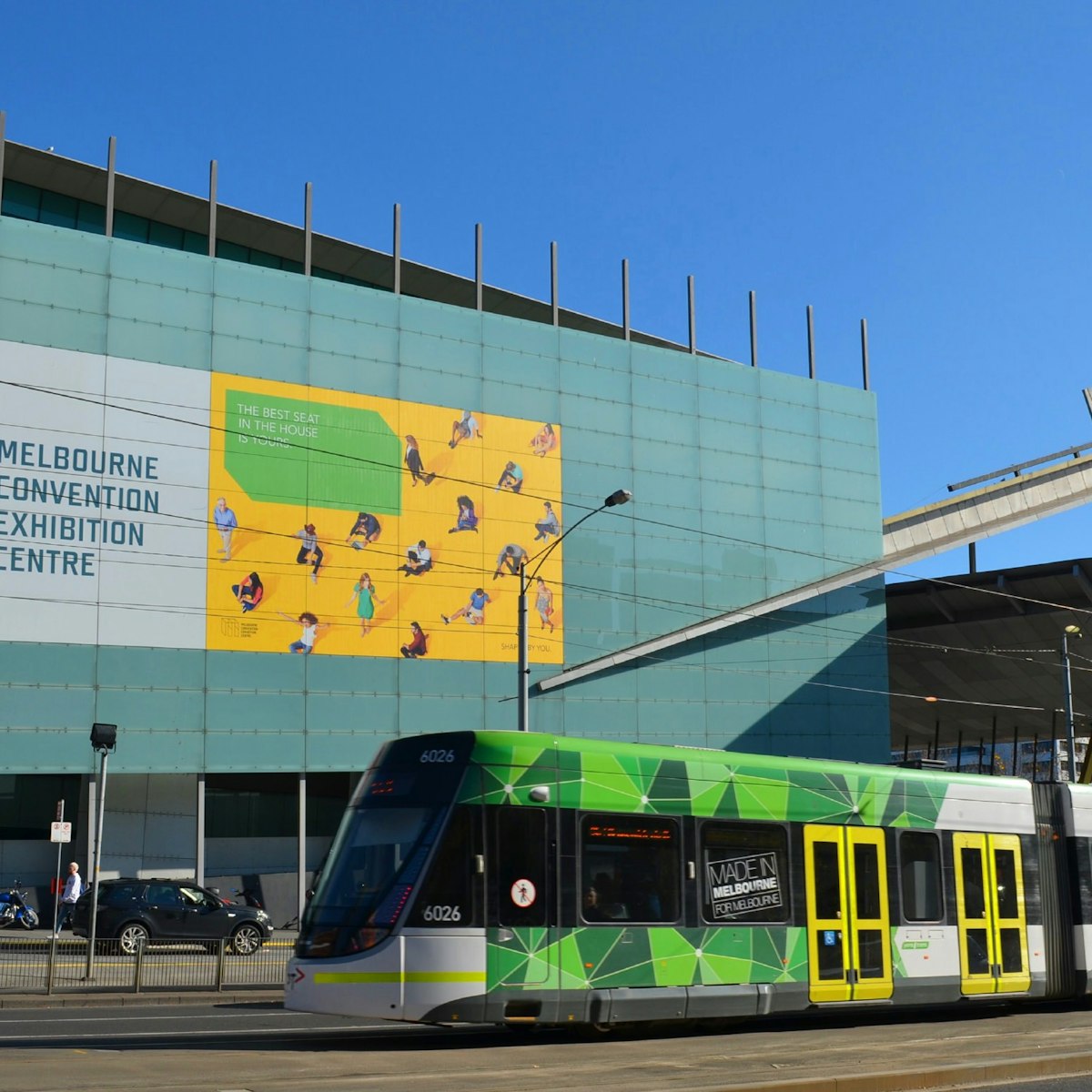 Entrance of the Melbourne Exhibition Centre with tram going by.