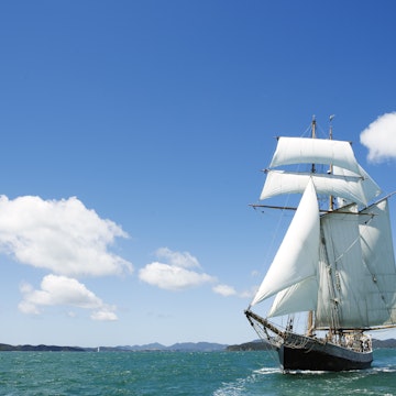 R Tucker Thompson, a 26-metre replica of a working 19th century schooner in Paradise Bay.