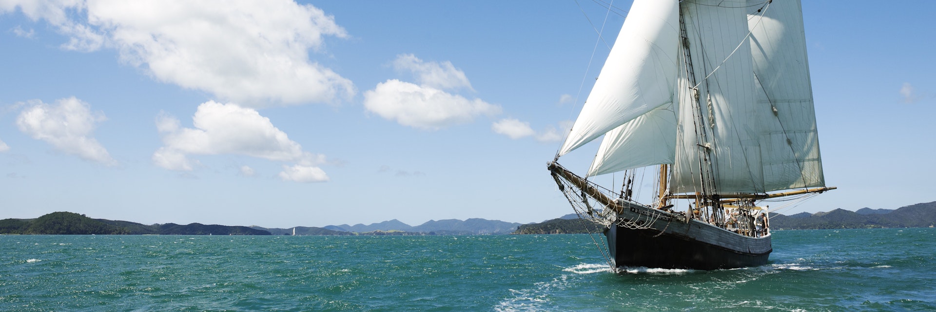 R Tucker Thompson, a 26-metre replica of a working 19th century schooner in Paradise Bay.