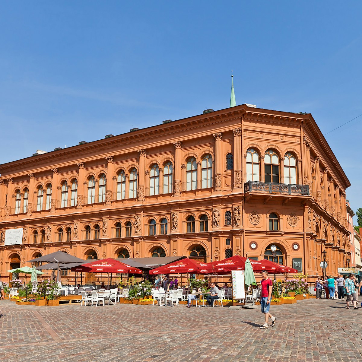 RIGA, LATVIA - MAY 25, 2014: Art Museum Riga Bourse (circa 1855) on Doms square. National architectural monument of Latvia, UNESCO world heritage site. Architect Harald Julius von Bosse; Shutterstock ID 197314394; Your name (First / Last): Gemma Graham; GL account no.: 65050; Netsuite department name: Online Editorial; Full Product or Project name including edition: 100 Cities Guides app image downloads
