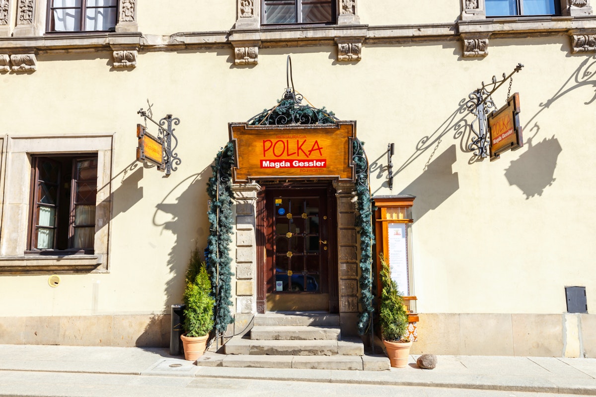WARSAW, POLAND, 13 march 2016: Restaurant in old town in Warsaw in a sunny day. Warsaw is the capital of Poland; Shutterstock ID 393660925; Your name (First / Last): Lauren Gillmore; GL account no.: 56530; Netsuite department name: Online-Design; Full Product or Project name including edition: 65050/ Online Design /LaurenGillmore/POI