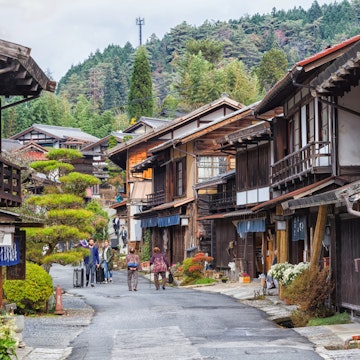 TSUMAGO, JAPAN - NOVEMBER 19, 2015: Scenic traditional post town in Japan from Edo period. Famous Nakasendo trail goes between Magome and Tsumago towns.