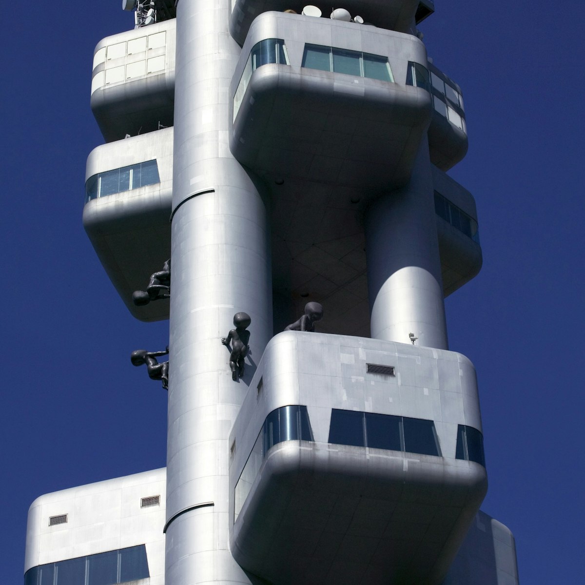 Zizkov TV Tower adorned with crawling baby sculptures.