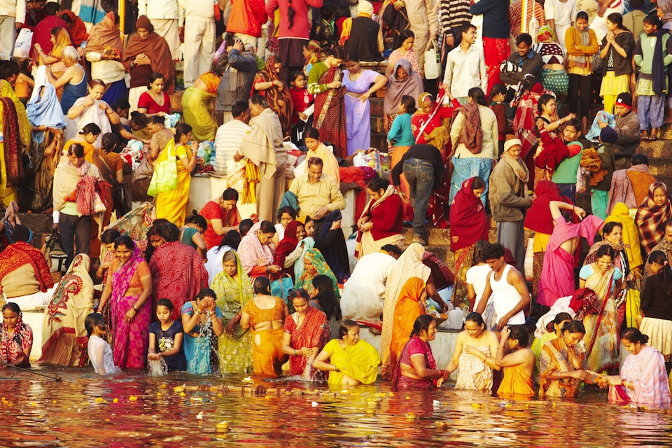 Crowd of people bathing in the Ganges.