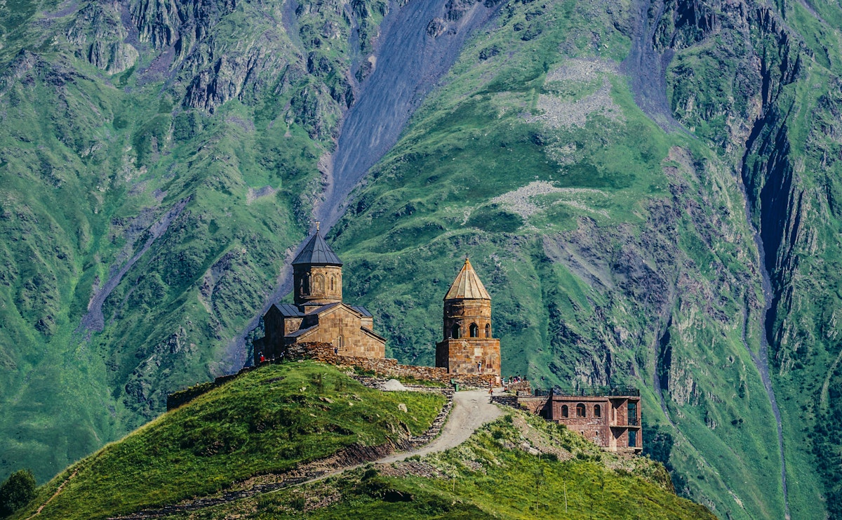 Gergeti, Georgia - July 20, 2015. One of the foremost Georgian landmarks - Tsminda Sameba church (english: Holy Trinity) near Gergeti town; Shutterstock ID 446367901; Your name (First / Last): Gemma Graham; GL account no.: 65050; Netsuite department name: Online Editorial; Full Product or Project name including edition: Georgia destination page masthead and POI images