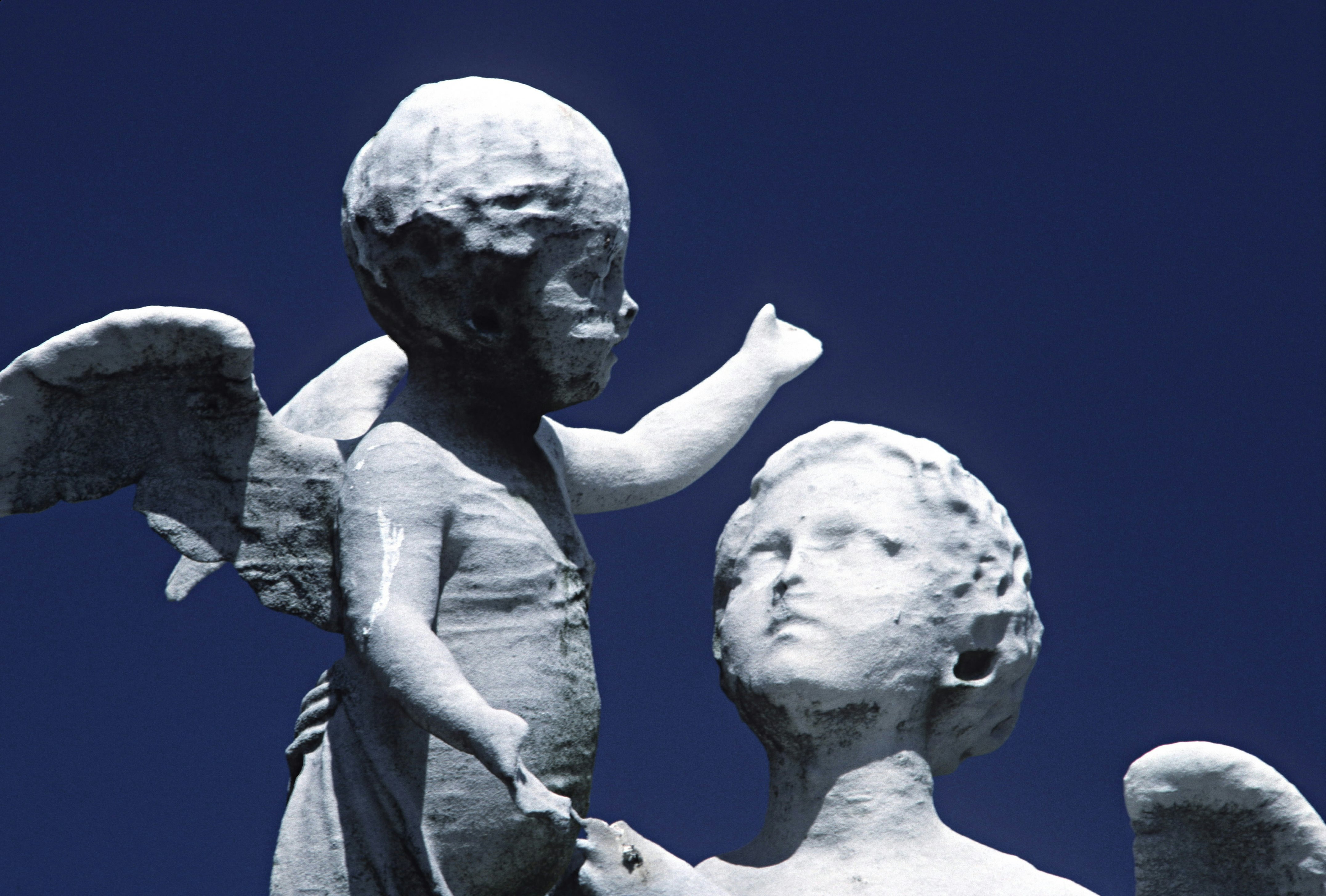 ACID RAIN DAMAGE TO STATUES. GREENWOOD CEMETERY. BROOKLYN, NY