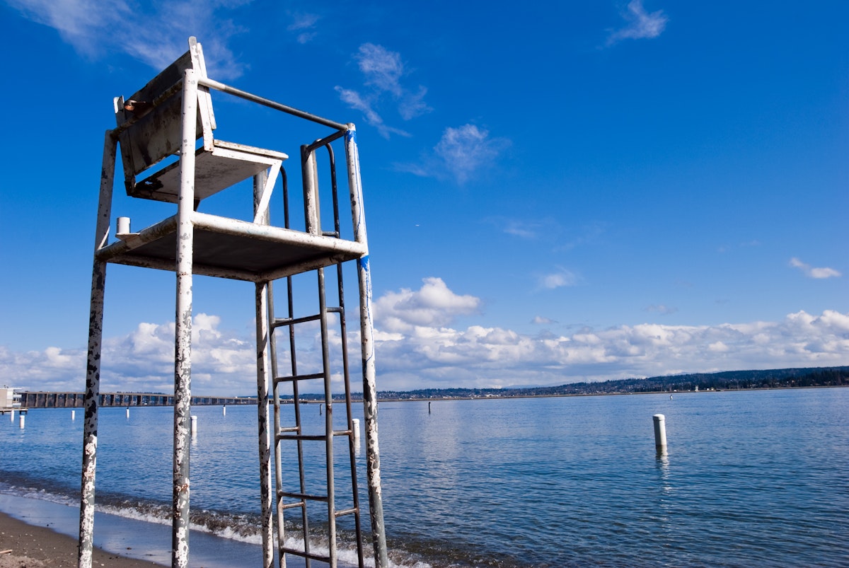 "Looking upwards at a lifeguard chair at Madison Park in Seattle, WA with Lake Washington in the background."