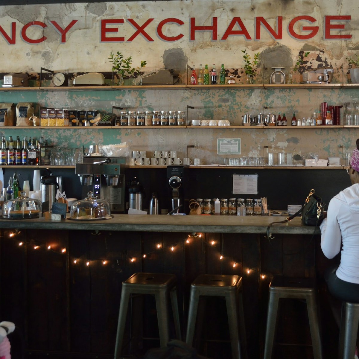 An actual defunct currency exchange is the setting for Washington Park's Currency Exchange Café