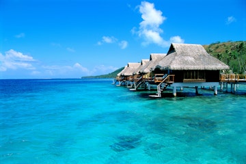 FP, Tahiti, Bora Bora Lagoon Resort bungalows over water, side view from ocean