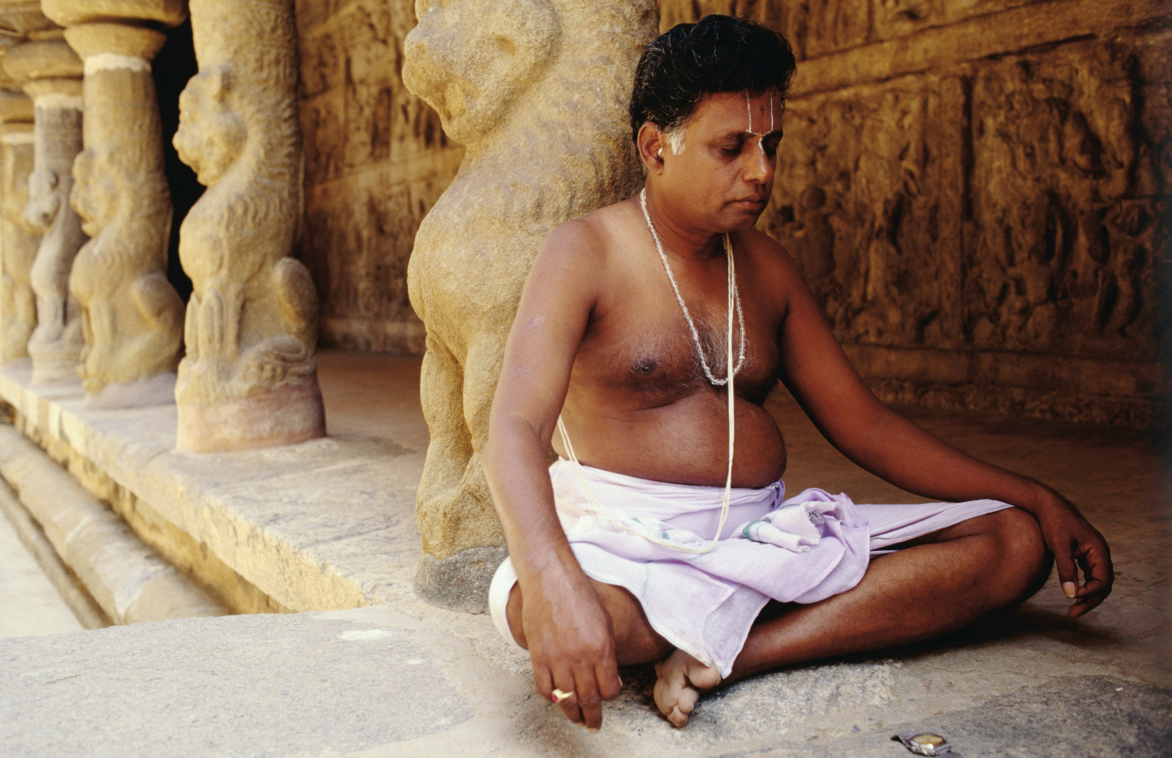 A priest meditating at the Vaikunta Perumal Temple in Kanchipuram