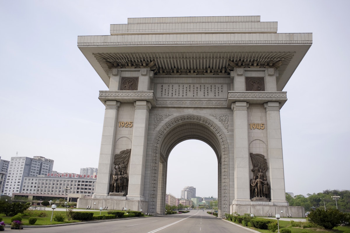 North Korea, Pyongyang. Arch of Triumph with deserted road which was erected in 1982 for Kim Il Sungs 70th birthday