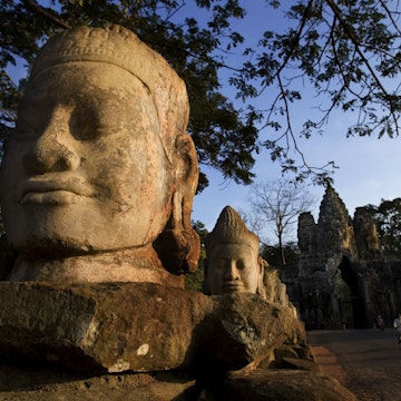 Large head sculpture at South Gate of Angkor Thom.
