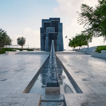 ABU DHABI, UAE - OCTOBER, 2018: Wahat Al Karama (Oasis of Dignity), permanent memorial for its martyrs, and Shaikh Zayed Grand Mosque.; Shutterstock ID 1243074628; Your name (First / Last): Lauren Keith; GL account no.: 65050; Netsuite department name: Online Editorial; Full Product or Project name including edition: Free things Abu Dhabi article