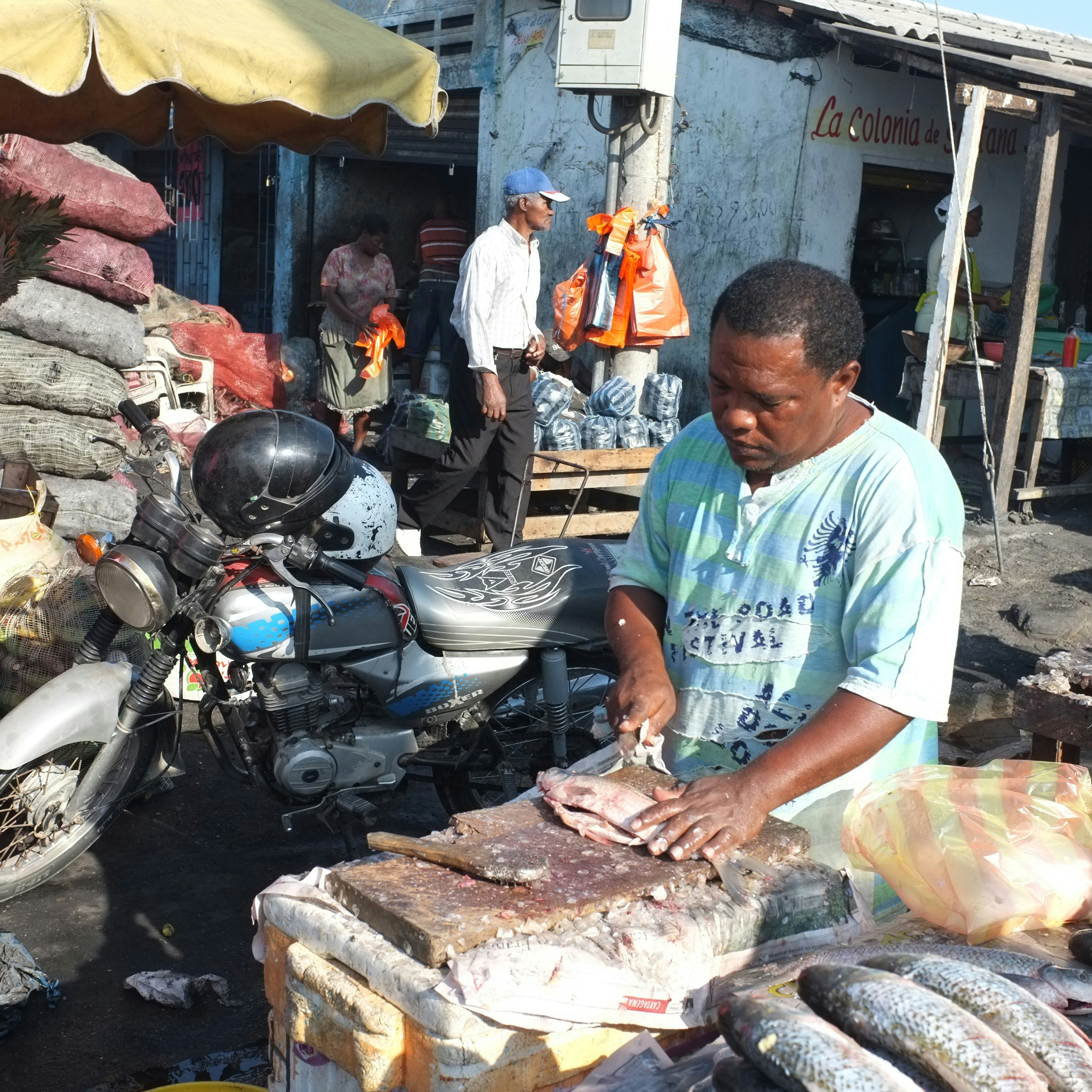 CARTAGENA of INDIAS, COLOMBIA - JANUARY 28, 2012: Fresh fish is cleaned and cut by a vendor in Bazurto market on January 28, 2012 in Cartagena, Colombia. Bazurto is a major urban market, colorful, chaotic and full of life. (Photo by Kaveh Kazemi/Getty Images)
