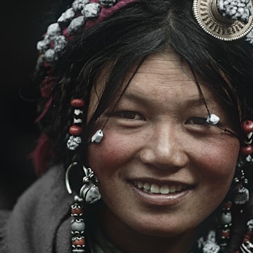 Young Tibetan Woman Wearing Traditional Hair Accessories