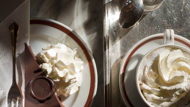 Torte cake and coffee on table top