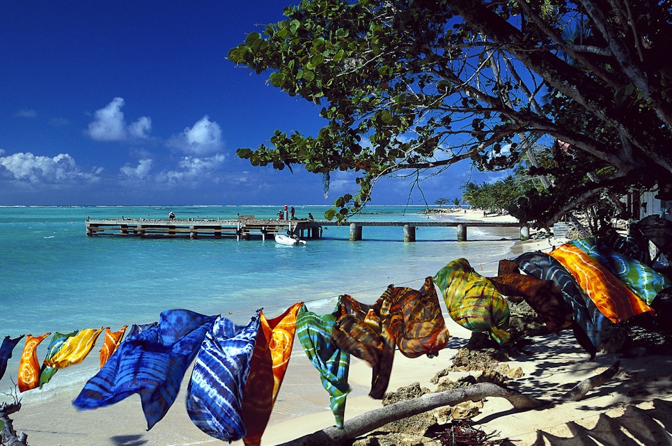 Sandy beach, colorful scarves, sarongs, Pigeon Point, Tobago, West Indies, Caribbean