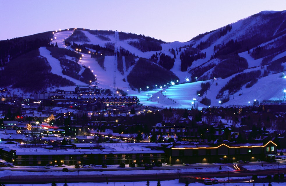 Overhead of Park City Ski Resort and ski runs, illuminated at dusk.