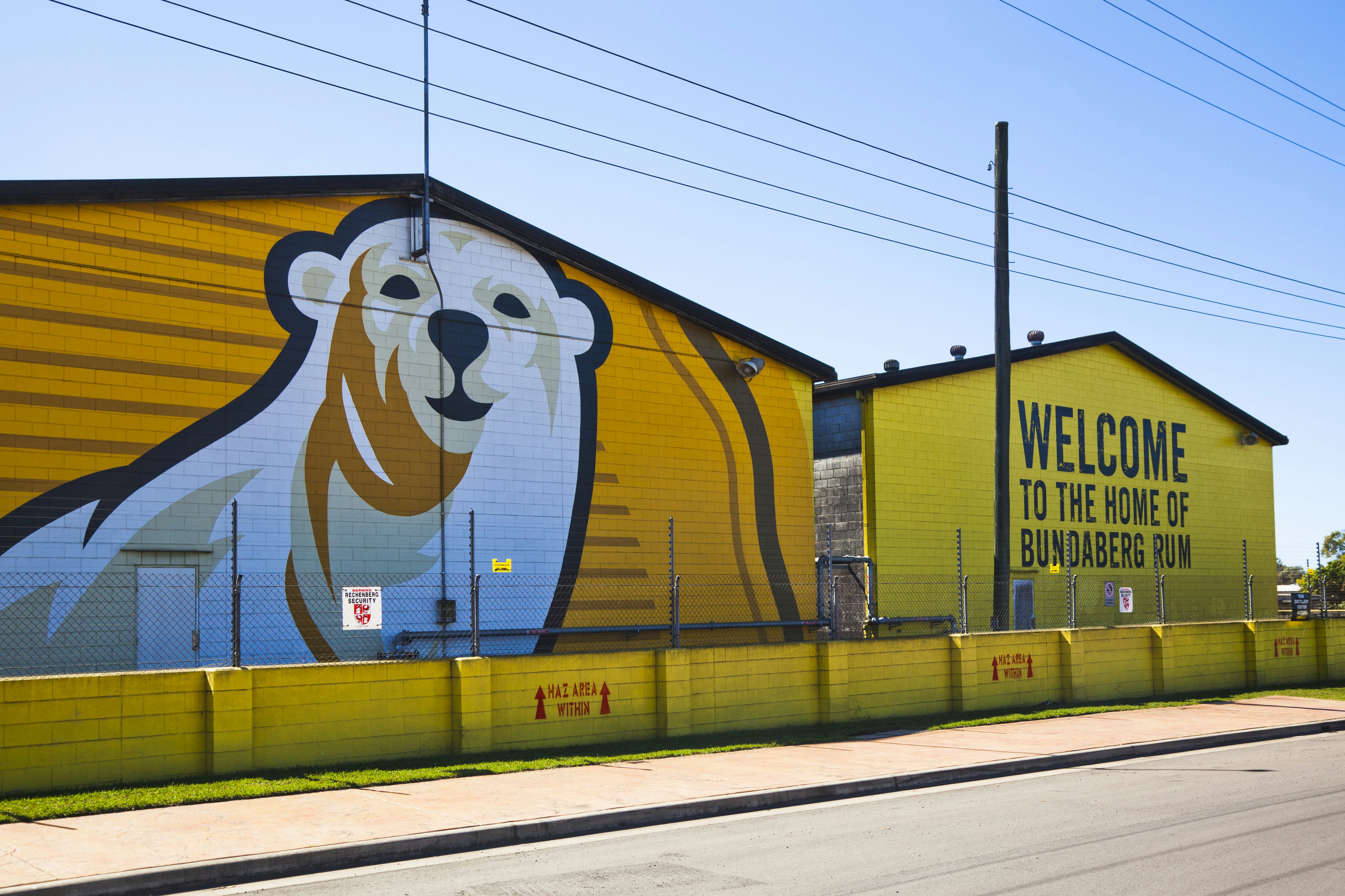 Huge company logo at factory walls of the Bundaberg Rum distillery.