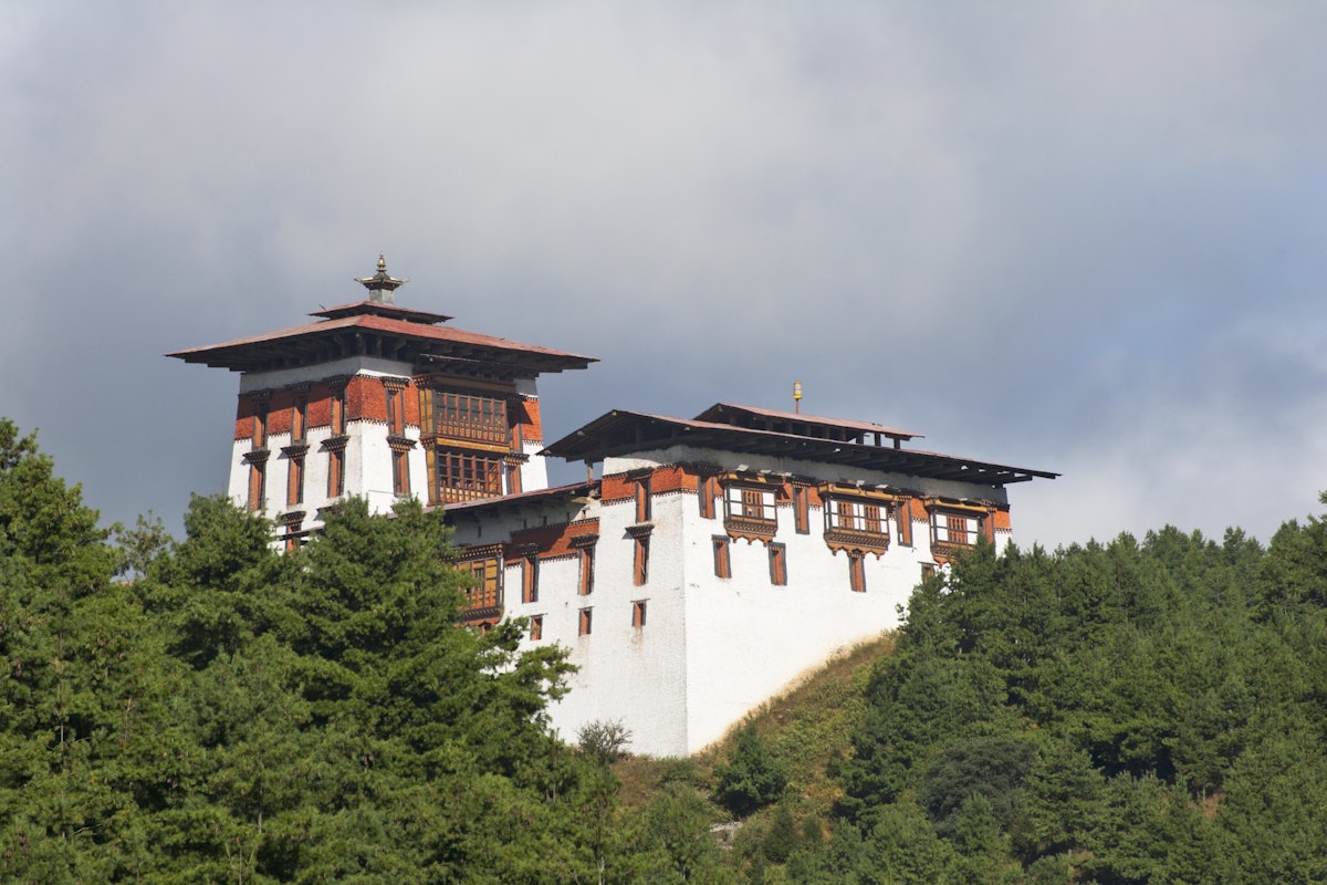Jakar Dzong in mountains.