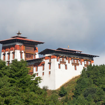 Jakar Dzong in mountains.
