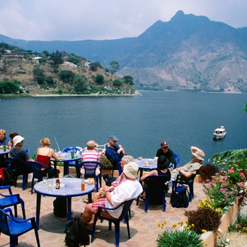 Tourists at lakefront cafe, San Pedro la Laguna.