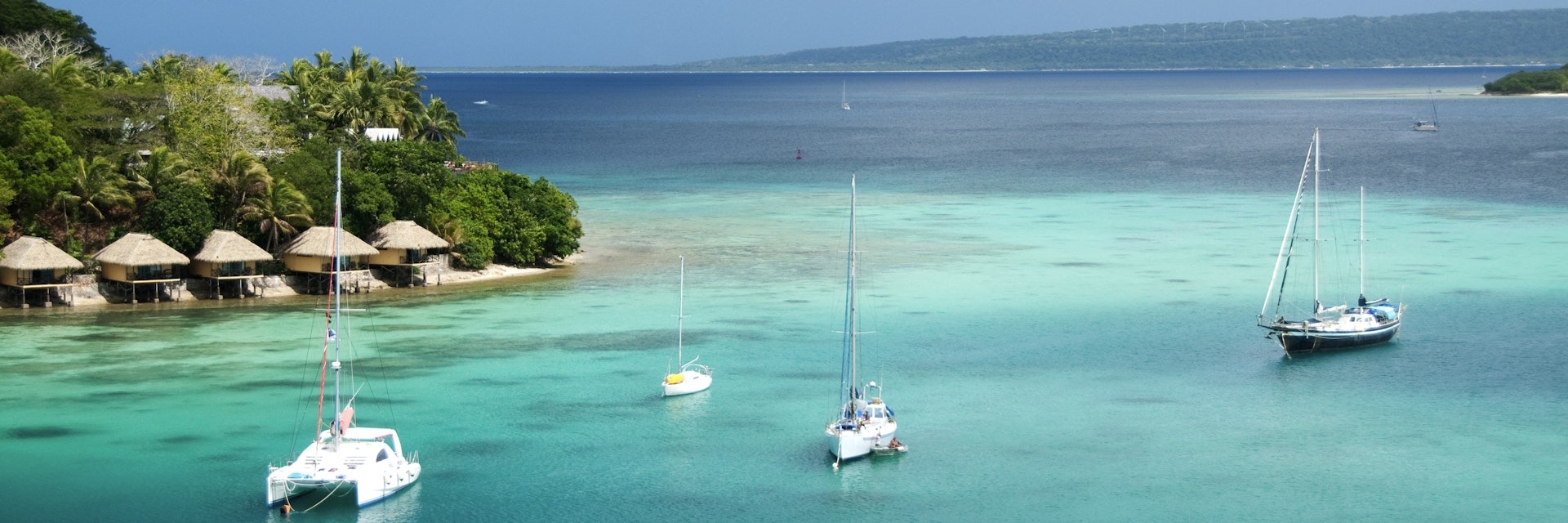 Bungalows on Iririki Island and yachts on Mele Bay from Port Vila.