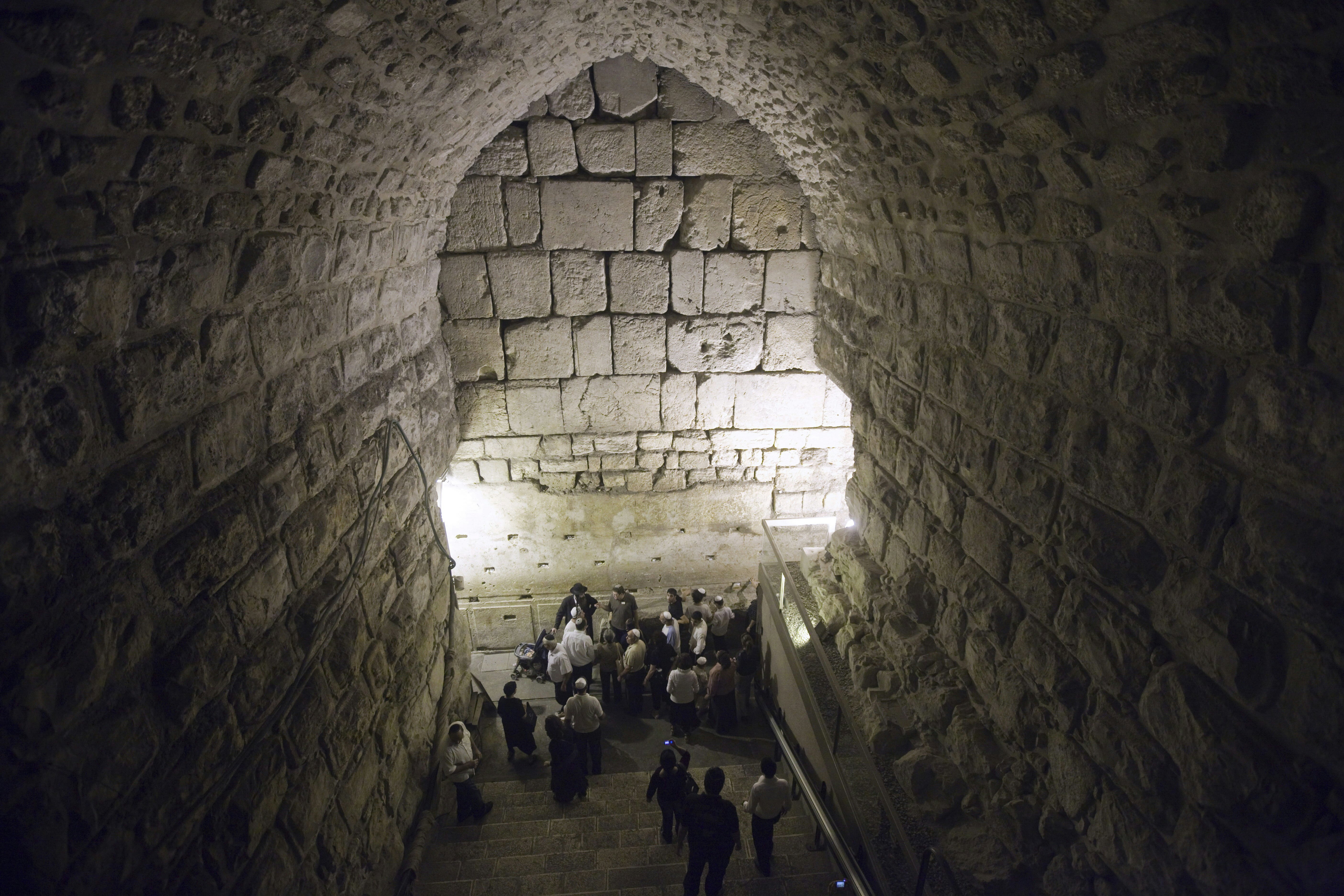 Tourists visit the site of excavations in the Western Wall tunnels, on October 22, 2009 in Jerusalem?s old city, during a tour organized by the Israeli Government Press Office to deny claims that the Israeli Antiquity Authority is conducting excavations underneath the al-Aqsa mosque compound. AFP PHOTO/ MENAHEM KAHANA        (Photo credit should read MENAHEM KAHANA/AFP/Getty Images)