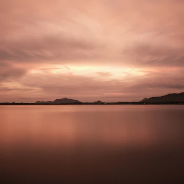 Artificial lake Tissa Wewa with clouds and long time exposure, Hambantota District, Tissamaharama, Sri Lanka
