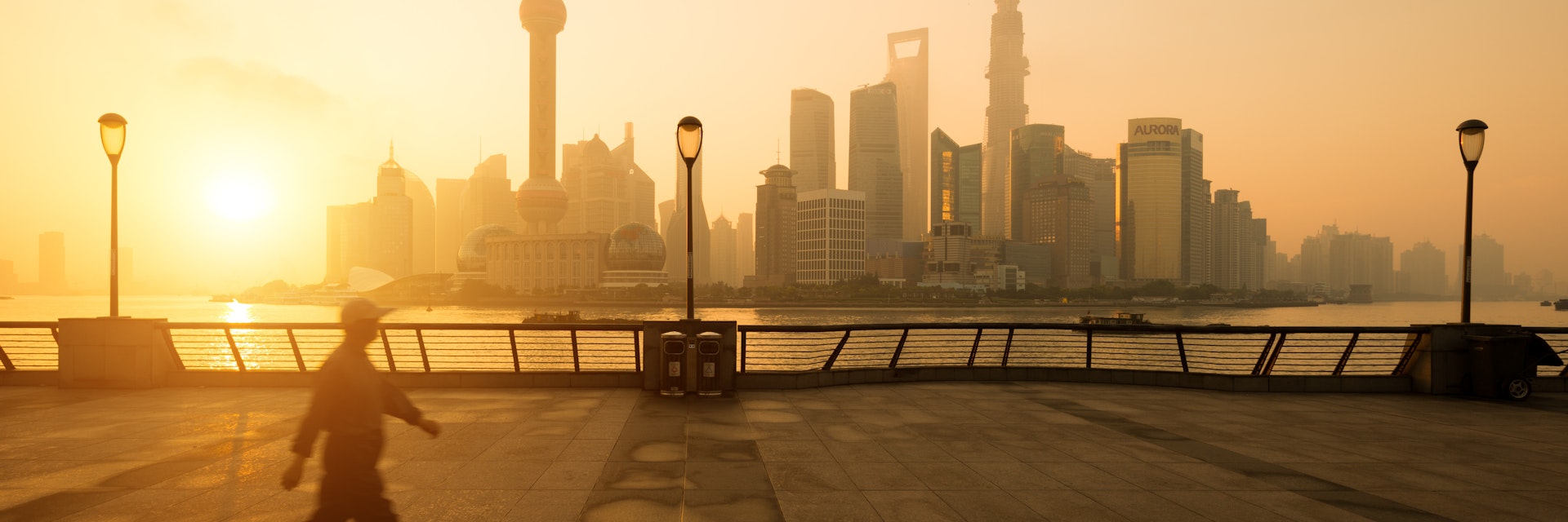 Sunrise on Bund Shanghai with walking man