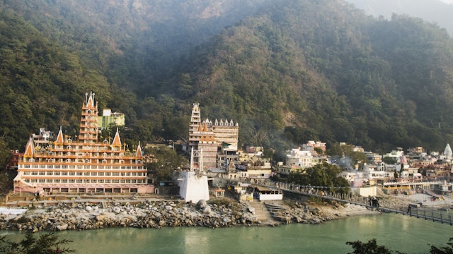 Temples at the riverbank, Swarg Niwas Temple, Lakshman Jhula, Ganges River, Rishikesh, Dehradun District, Uttarakhand, India