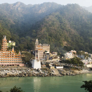 Temples at the riverbank, Swarg Niwas Temple, Lakshman Jhula, Ganges River, Rishikesh, Dehradun District, Uttarakhand, India