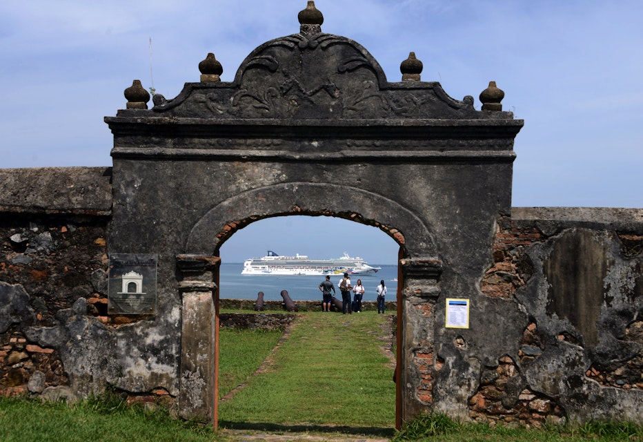 View of a cruise ship through the Santa Barbara fortress while she heads to Trujillo, 600km north of Tegucigalpa on October 15, 2014.    AFP PHOTO / Orlando SIERRA        (Photo credit should read ORLANDO SIERRA/AFP/Getty Images)
