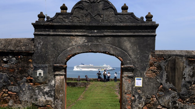 View of a cruise ship through the Santa Barbara fortress while she heads to Trujillo, 600km north of Tegucigalpa on October 15, 2014.    AFP PHOTO / Orlando SIERRA        (Photo credit should read ORLANDO SIERRA/AFP/Getty Images)