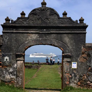 View of a cruise ship through the Santa Barbara fortress while she heads to Trujillo, 600km north of Tegucigalpa on October 15, 2014. AFP PHOTO / Orlando SIERRA (Photo credit should read ORLANDO SIERRA/AFP/Getty Images)