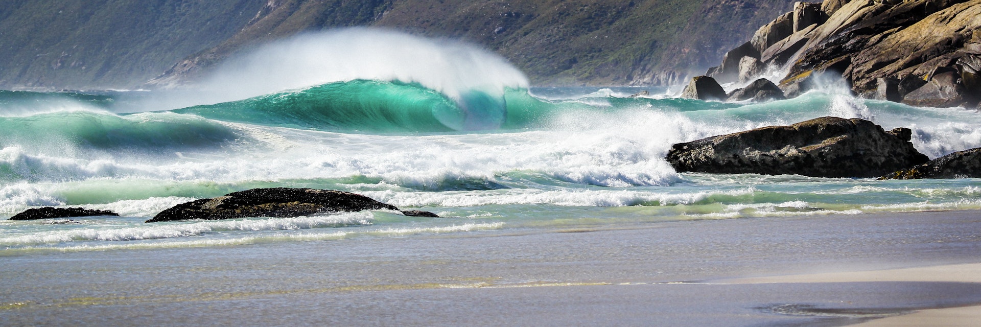 Wave at Noordhoek Beach in Cape Town, South Africa