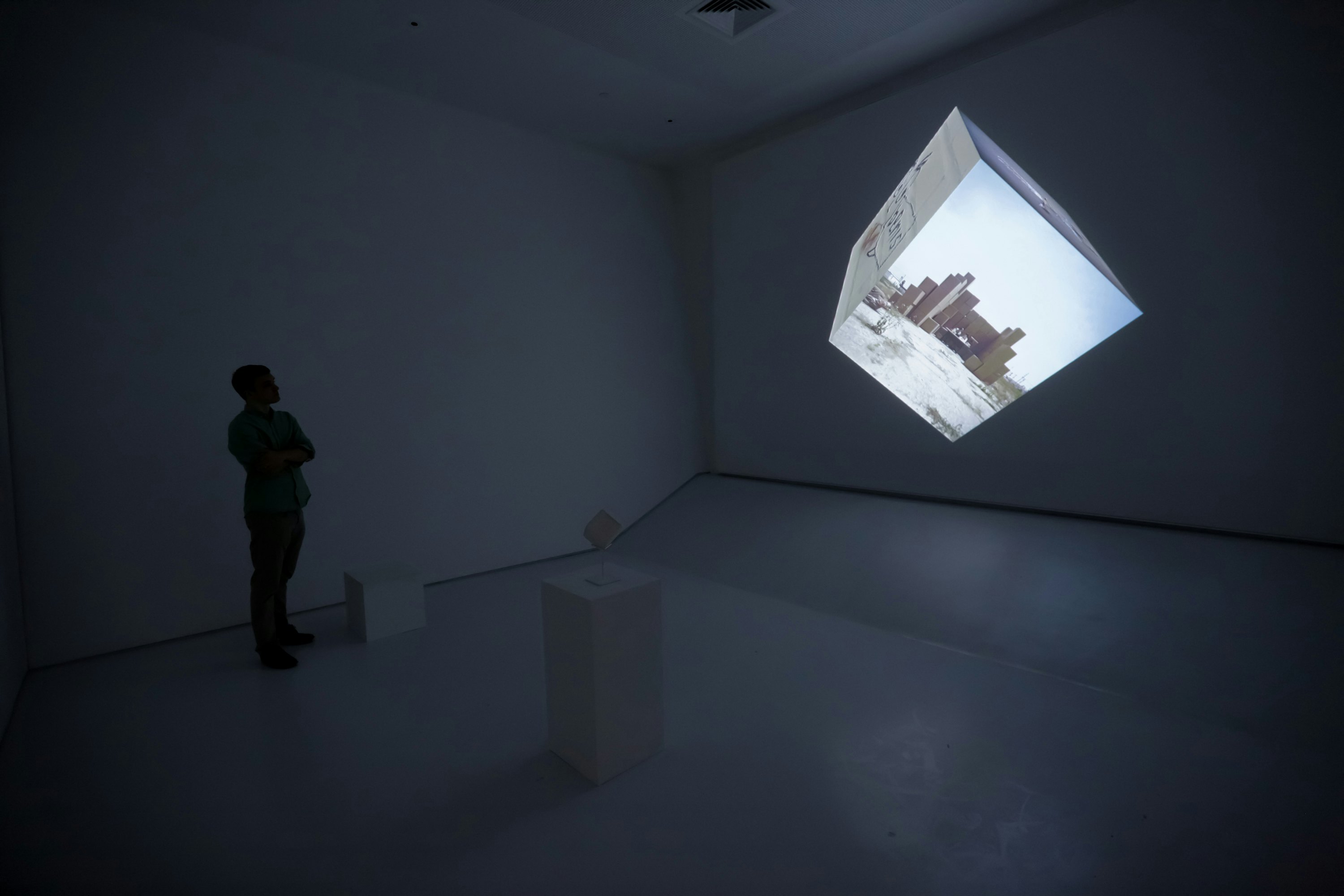 NEW YORK, NY - APRIL 14:  A preview attendee explores an interactive film exhibit entitled "Google Cube-Untitled" during the Sensory Stories Press Preview held at the Museum of the Moving Image on April 14, 2015 in New York City.  (Photo by Brent N. Clarke/Getty Images)