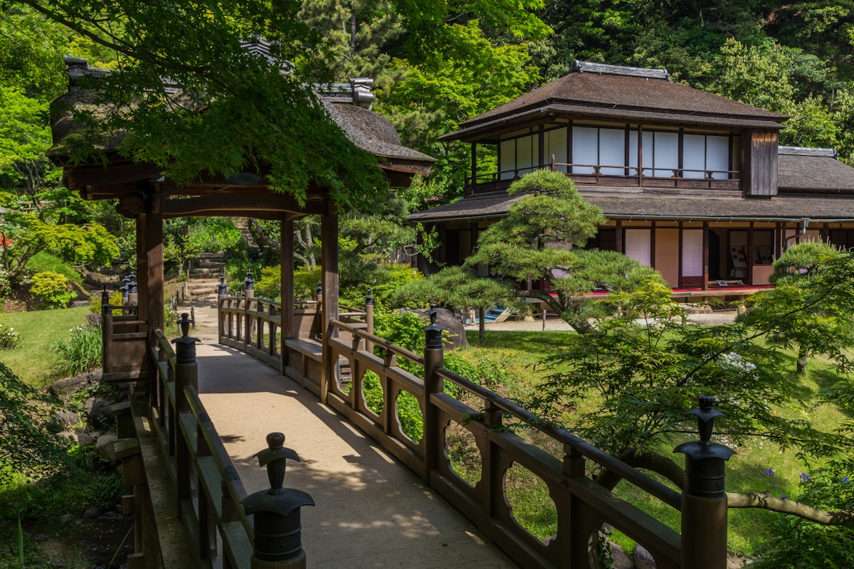 YOKOHAMA, KANAGAWA-KEN, JAPAN - 2015/05/06: Sankeien was once the private property of the silk baron Hara Sankei, and was opened to the public in 1904. Hara wanted to share the beauty of his fortune by opening up his grounds. The cherry blossoms in spring and maple leaves in autumn make Sankeien a favorite spot in Yokohama for both residents and visitors.  Besides the landmark three-storied pagoda, koi ponds, streams and an elegant feudal lords residence, numerous tea houses are scattered through the garden. (Photo by John S Lander/LightRocket via Getty Images)