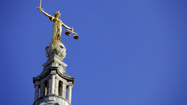 Scales of Justice above the Old Bailey Law Courts (Central Criminal Court) on former site of Newgate Prison, London, England, United Kingdom, Europe