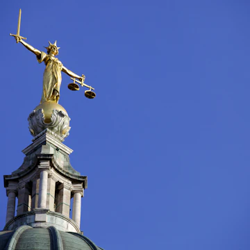 Scales of Justice above the Old Bailey Law Courts (Central Criminal Court) on former site of Newgate Prison, London, England, United Kingdom, Europe