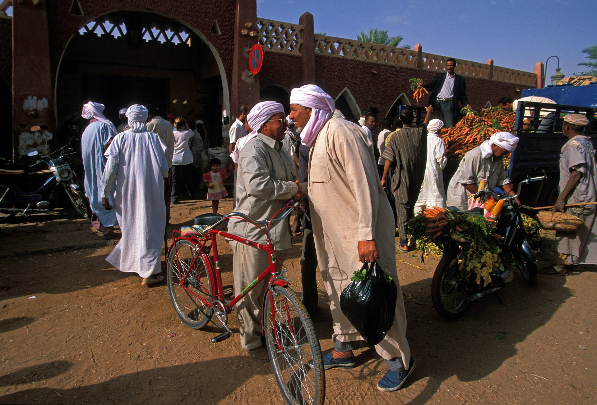 Tuareg people of Timimoun in Algeria at the shops in a market.