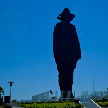 Silhouettes of statue of General Augusto Sandino in Managua, Nicaragua.
