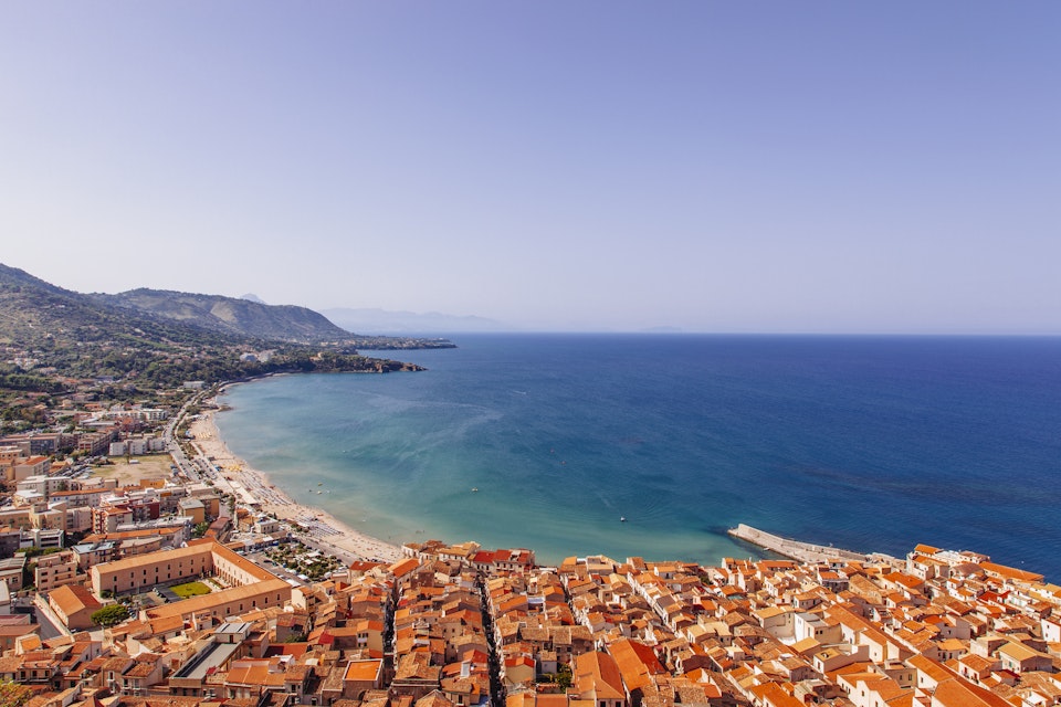 View of coastline and town of Cefalu, Sicily, Italy