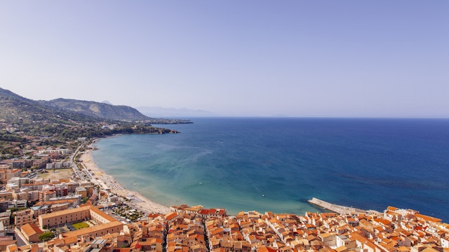 View of coastline and town of Cefalu, Sicily, Italy