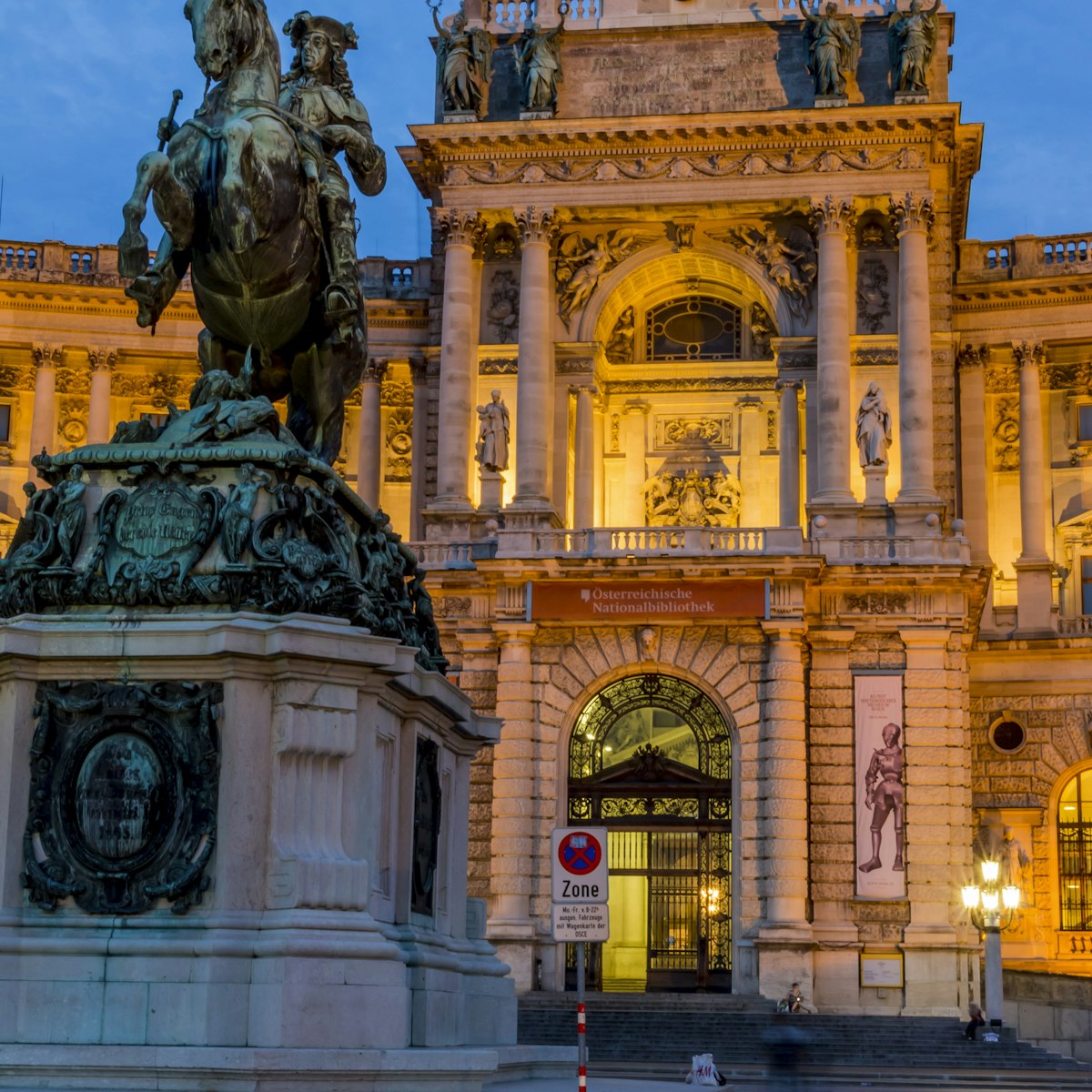 Austria, Vienna, view to lighted Hofburg Palace at twilight