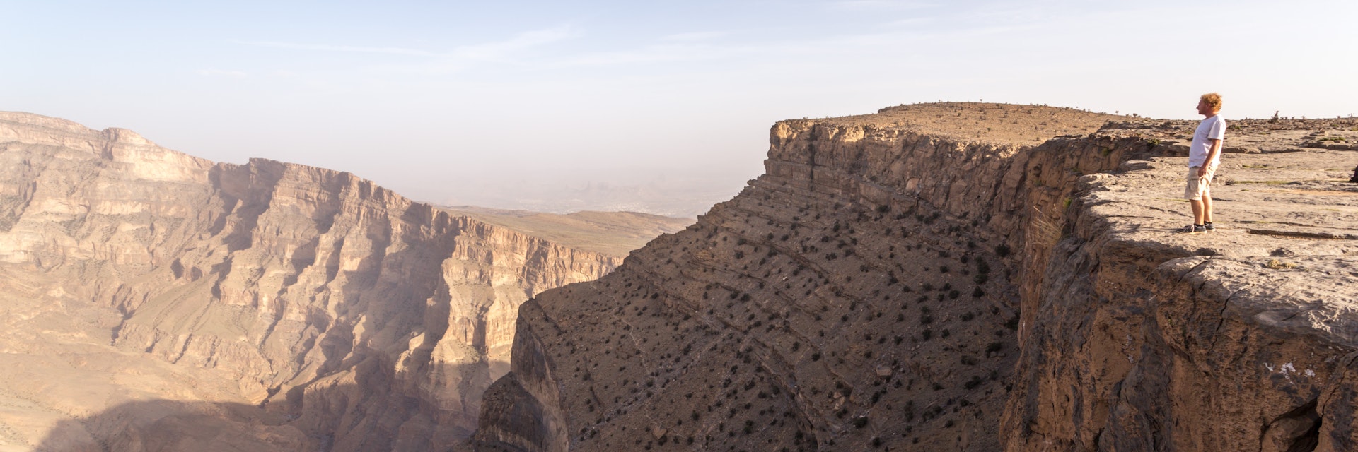Man standing on the edge of Jebel Akhdar canyon
